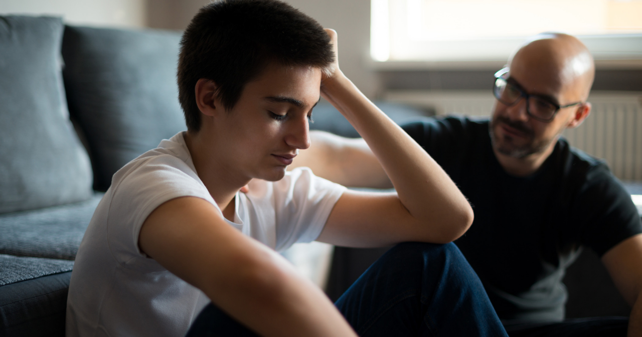 mentor talking with teenage boy 