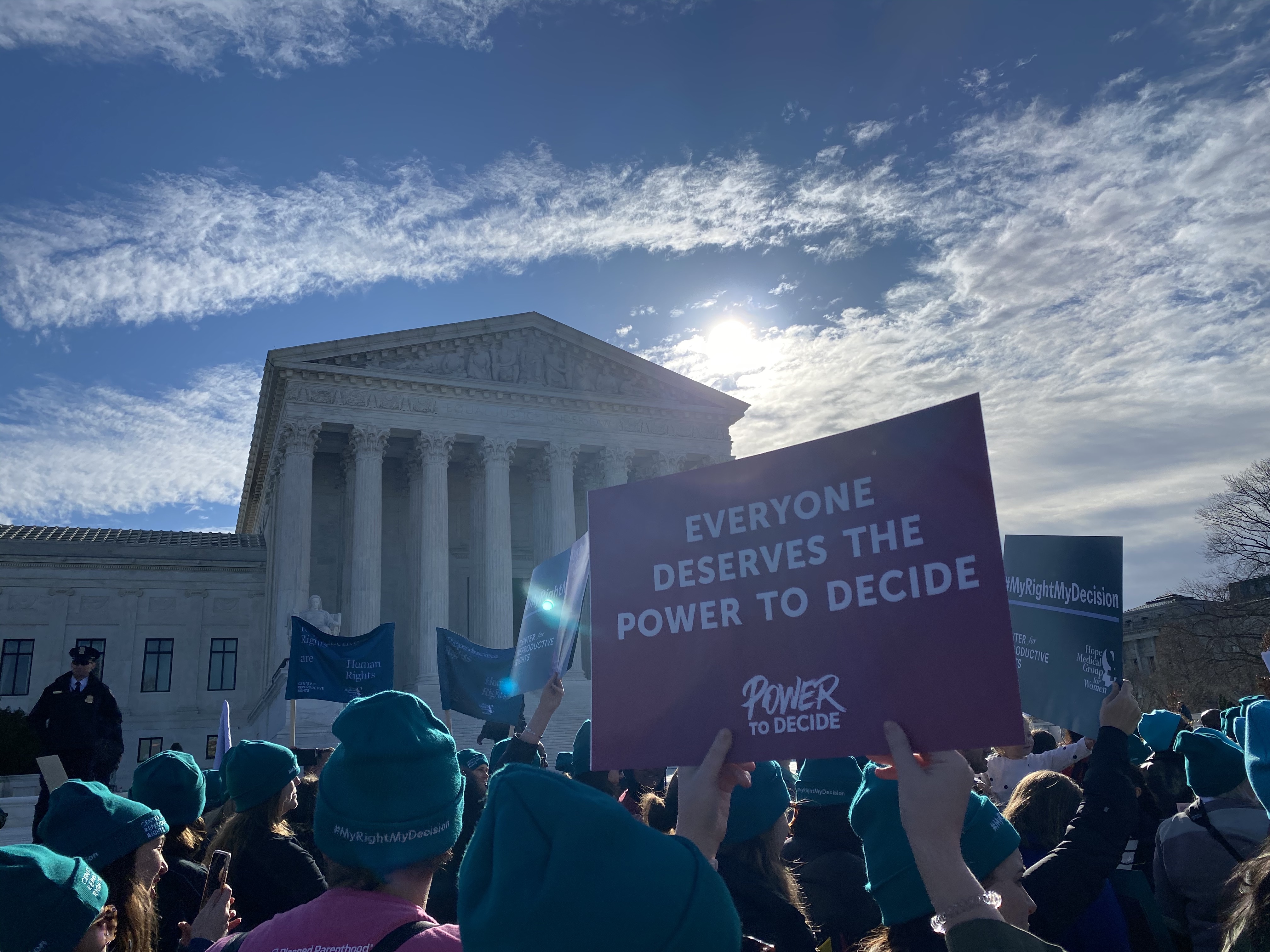 Power to Decide staff holding signs at the rally. 