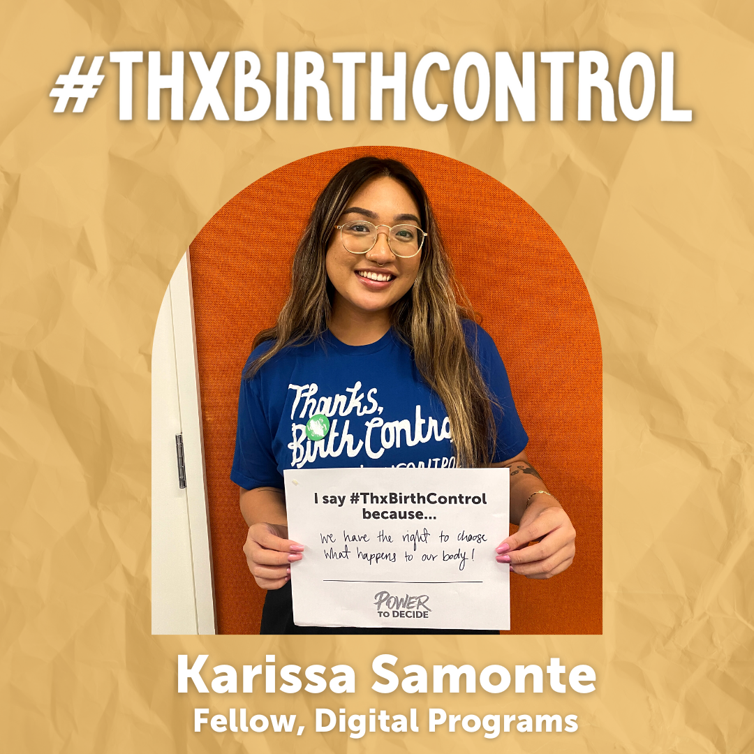A Power to Decide Staffer holds a sign with their reason for saying #ThxBirthControl.