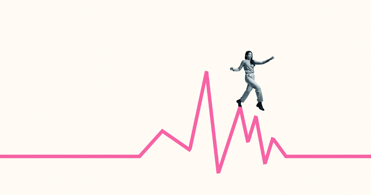 An image of a woman walking along the highs of a line graph. 