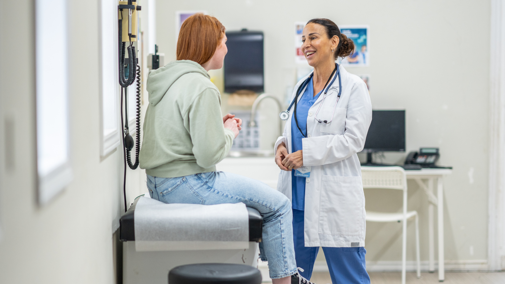 Blog Cover doctor with adolescent talking in office