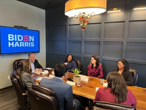 A photo of Doug Emhoff speaking with a roundtable of people who support reproductive health in Nebraska. 
