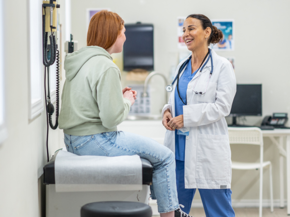 Blog Cover doctor with adolescent talking in office